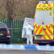 A forensic officer at the scene in Shetland Close, Bradford, on Tuesday